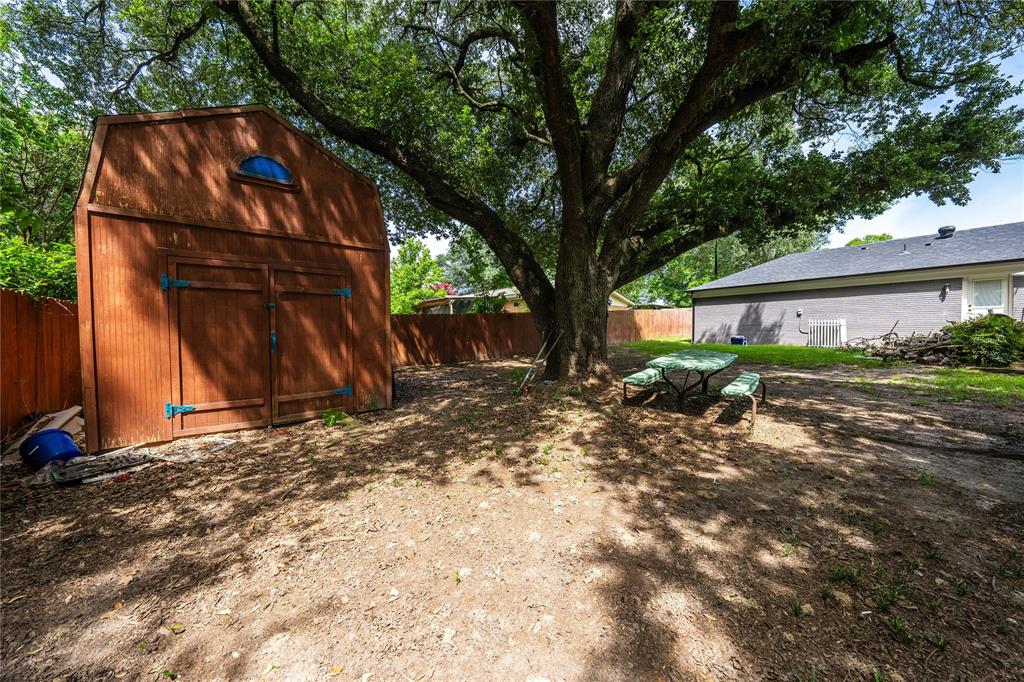 603 Mosley Road Athens, TX 75751 - Photo 14 of 14 a backyard of a house with plants and large tree