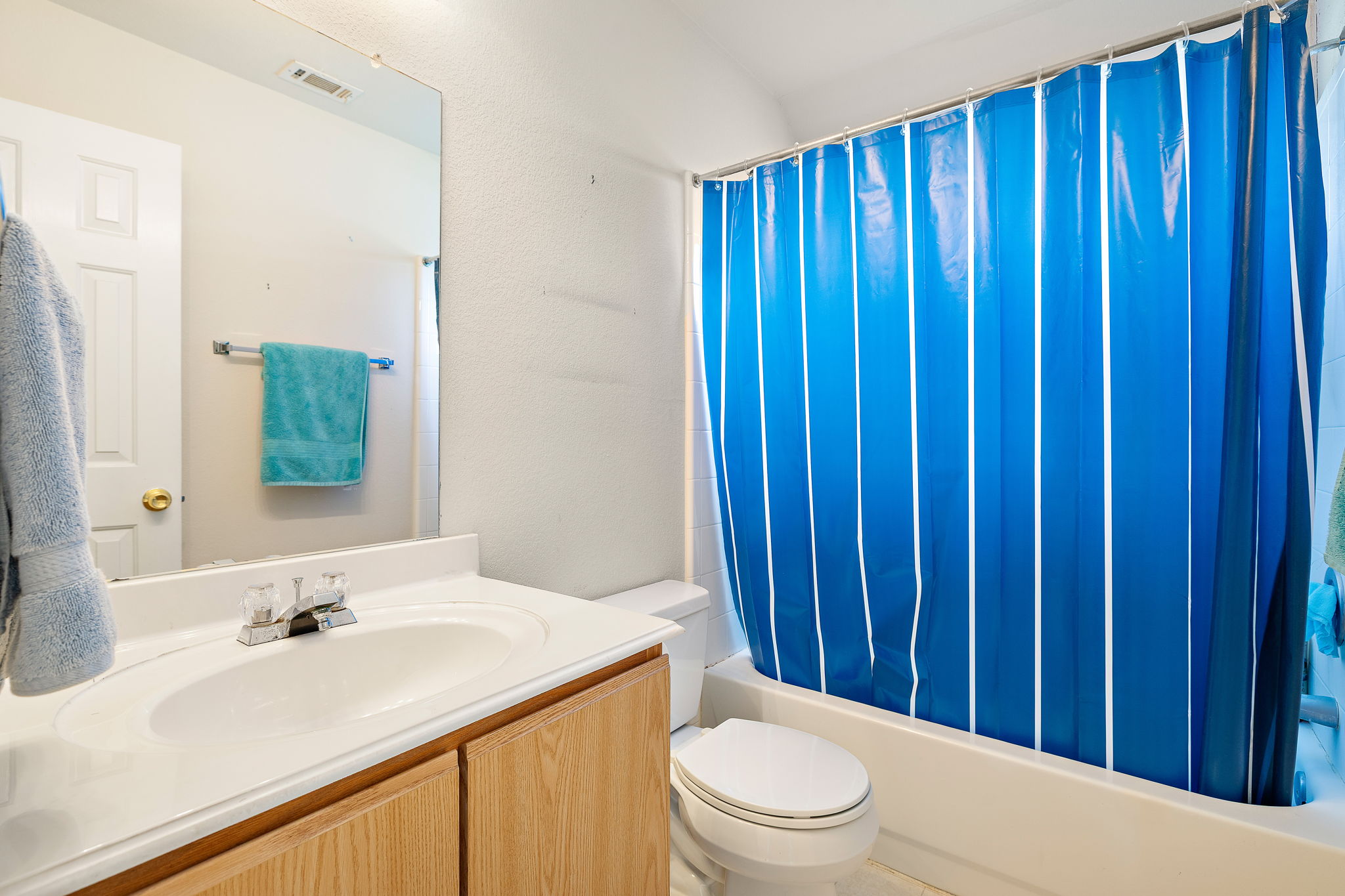 615 Runners Ridge Pflugerville, TX 78660 - Photo 23 of 32 a bathroom with a sink a toilet and shower