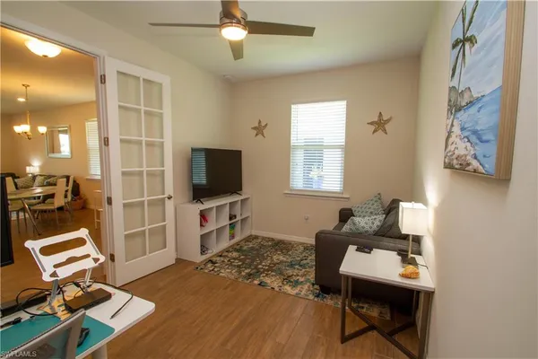 a living room with furniture and a flat screen tv