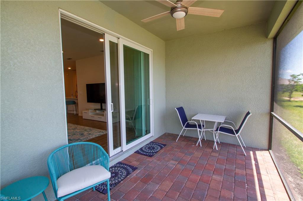 1241 Enbrook Loop Naples, FL 34114 - Photo 31 of 50 a dining room with furniture and wooden floor