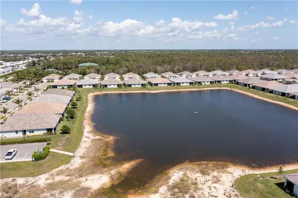 an aerial view of a house with a ocean view