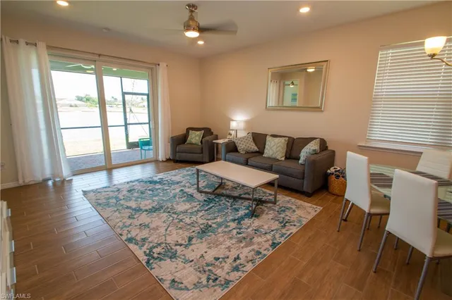 a living room with furniture and a rug
