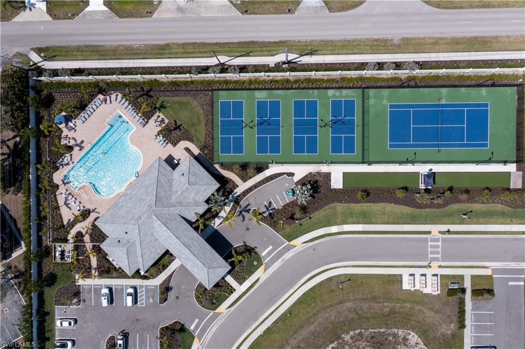 1241 Enbrook Loop Naples, FL 34114 - Photo 43 of 50 an aerial view of a house with a swimming pool