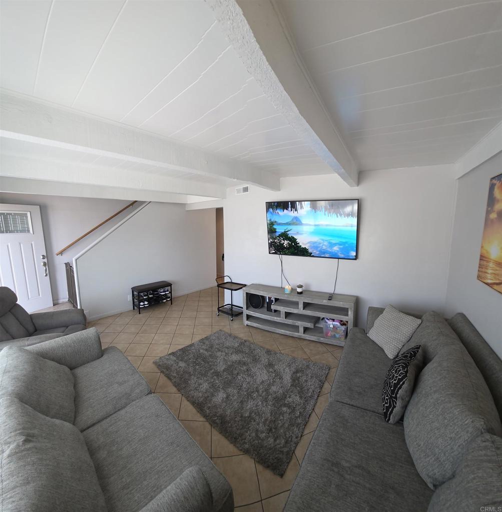 847 Raintree Place Vista, CA 92084 - Photo 4 of 14 a living room with furniture and a flat screen tv