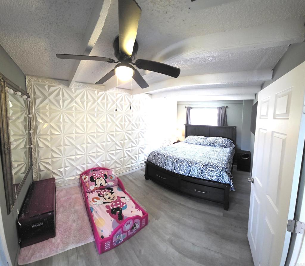 847 Raintree Place Vista, CA 92084 - Photo 7 of 14 a bedroom with a bed dresser and a window