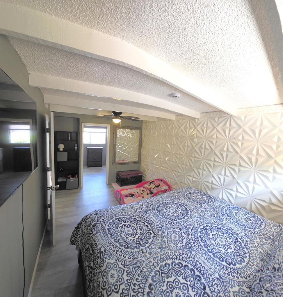 847 Raintree Place Vista, CA 92084 - Photo 8 of 14 a bedroom with a bed and window