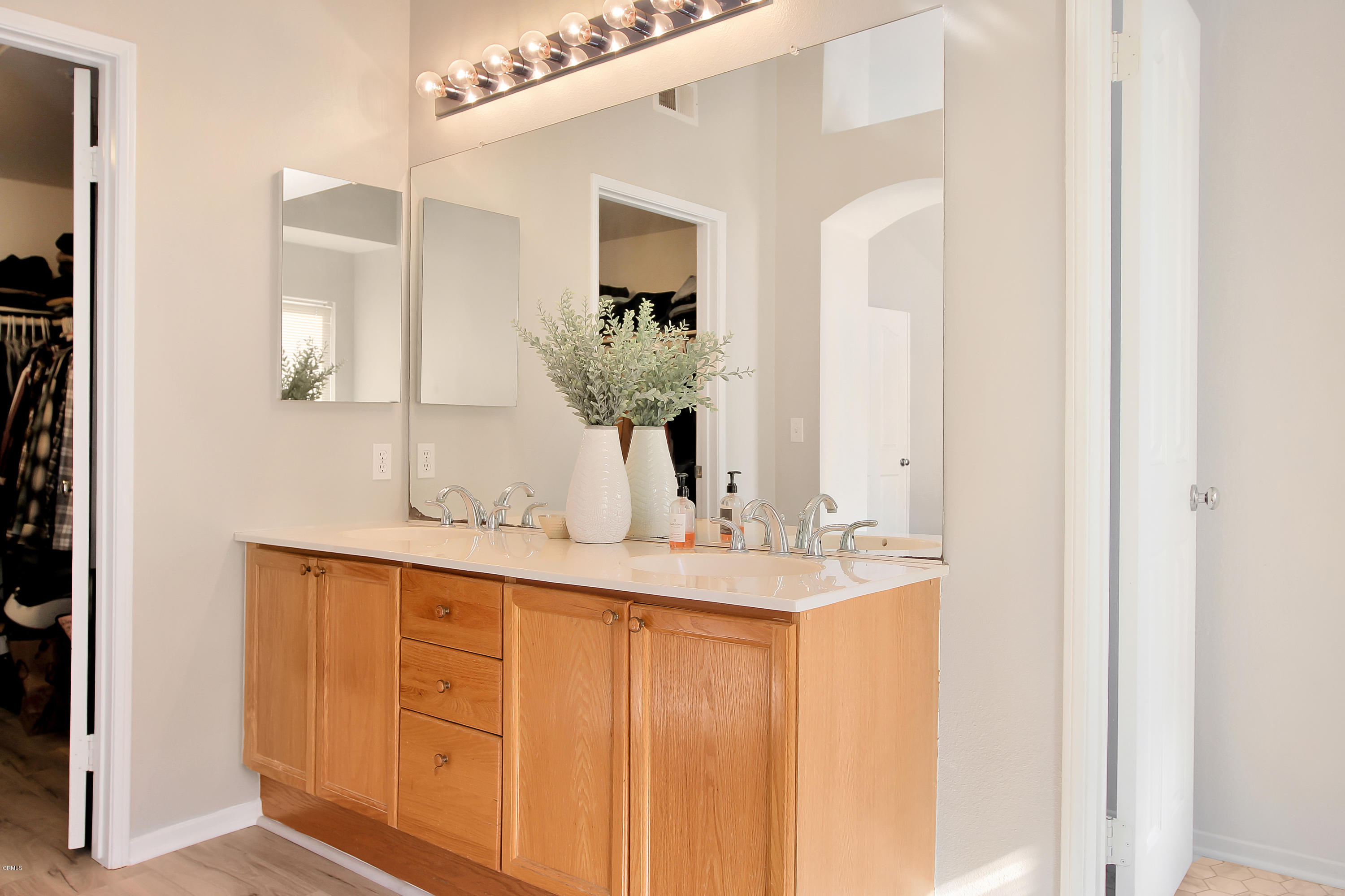 1303 Lost Point Lane Oxnard, CA 93030 - Photo 14 of 28 a bathroom with a double vanity sink and a mirror
