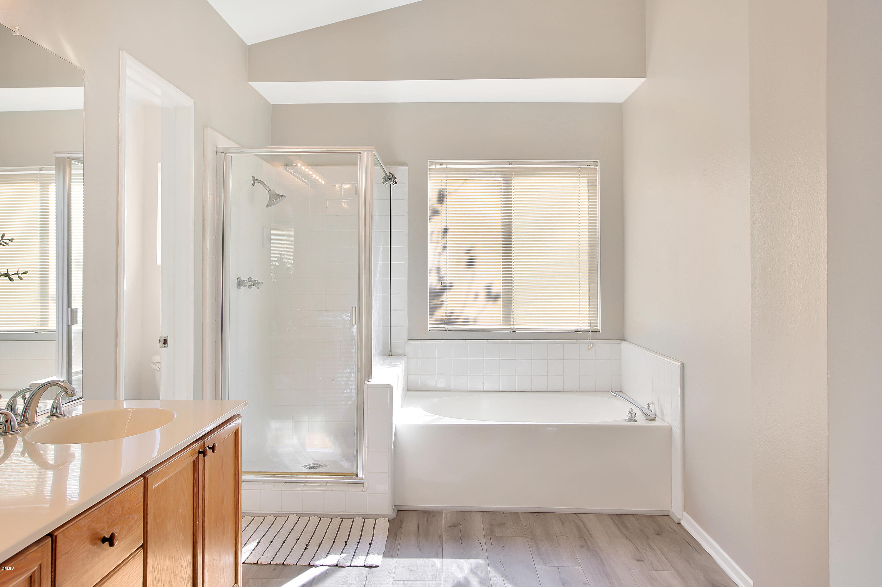 1303 Lost Point Lane Oxnard, CA 93030 - Photo 15 of 28 a bathroom with a bathtub and a sink