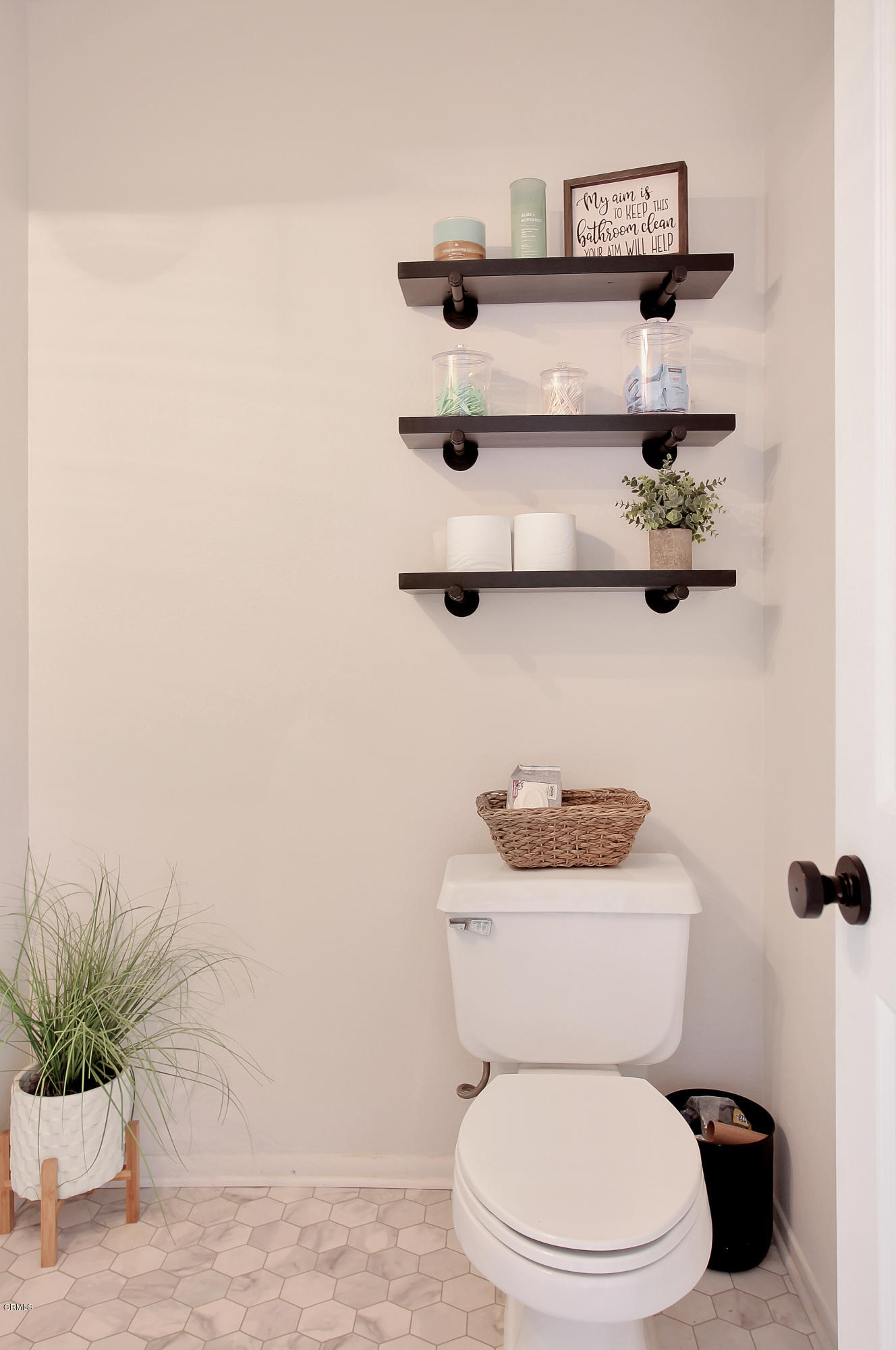 1303 Lost Point Lane Oxnard, CA 93030 - Photo 20 of 28 a white toilet sitting next to a bathroom sink