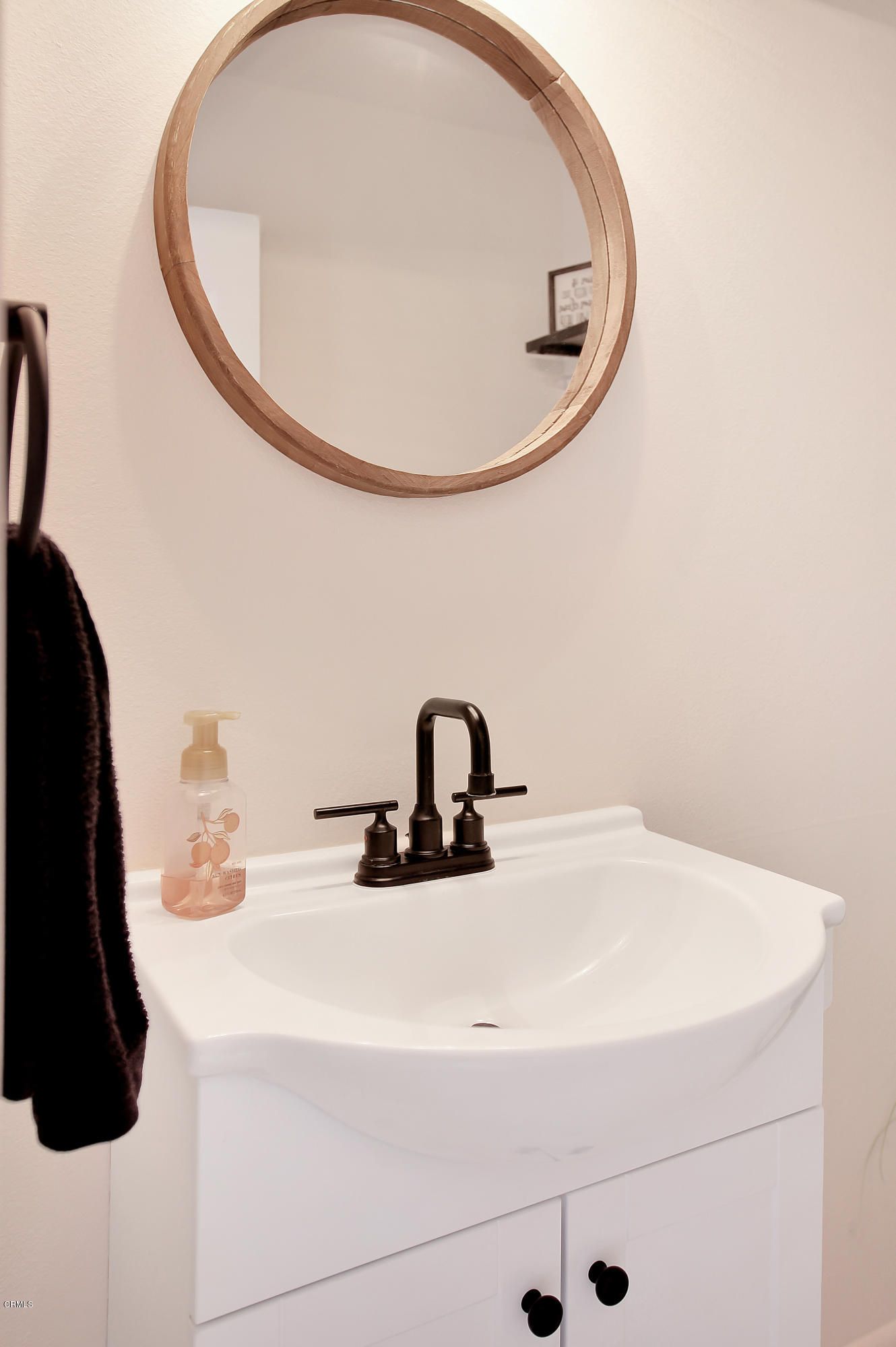 1303 Lost Point Lane Oxnard, CA 93030 - Photo 21 of 28 a bathroom with a sink and mirror