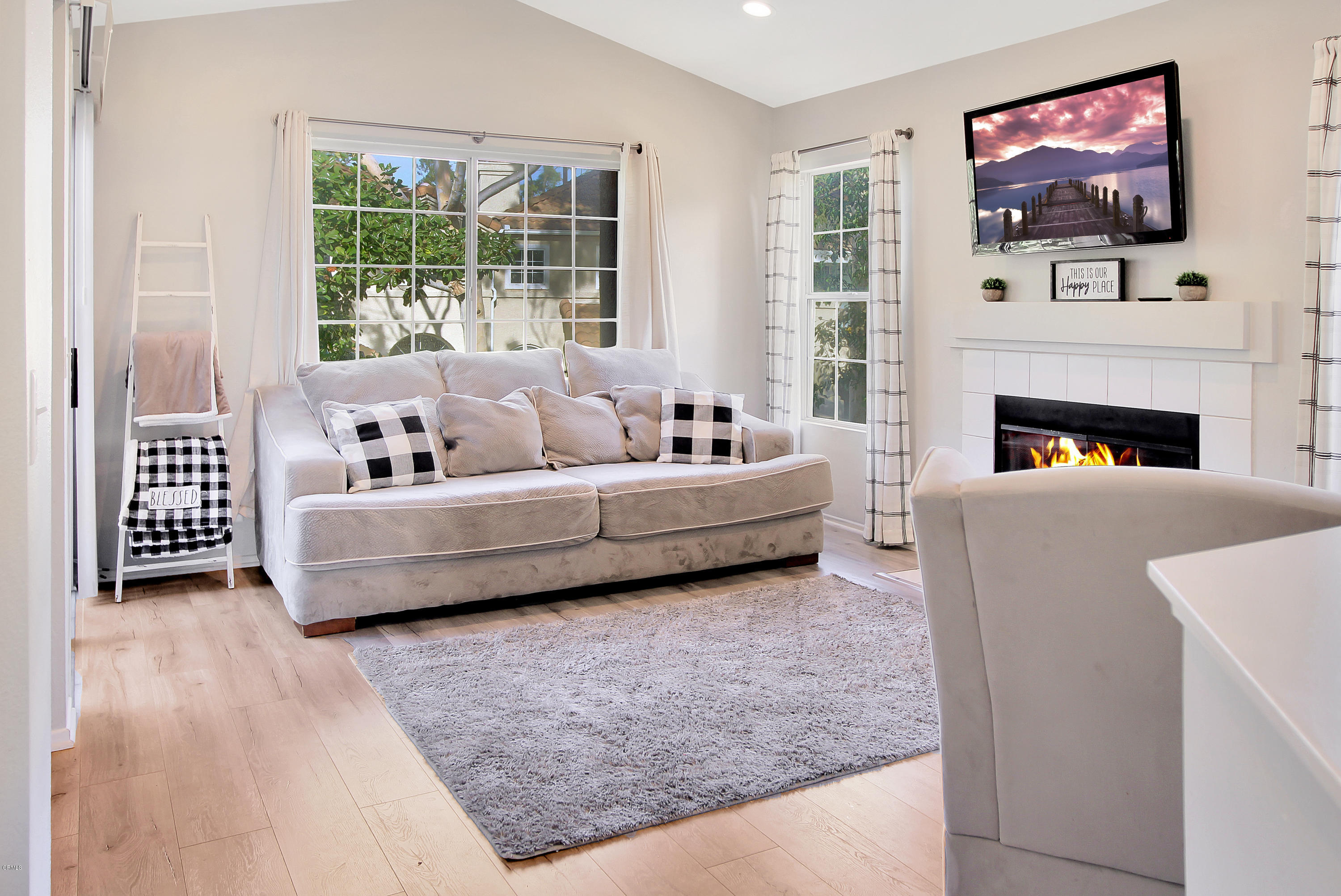 1303 Lost Point Lane Oxnard, CA 93030 - Photo 8 of 28 a living room with furniture and a flat screen tv