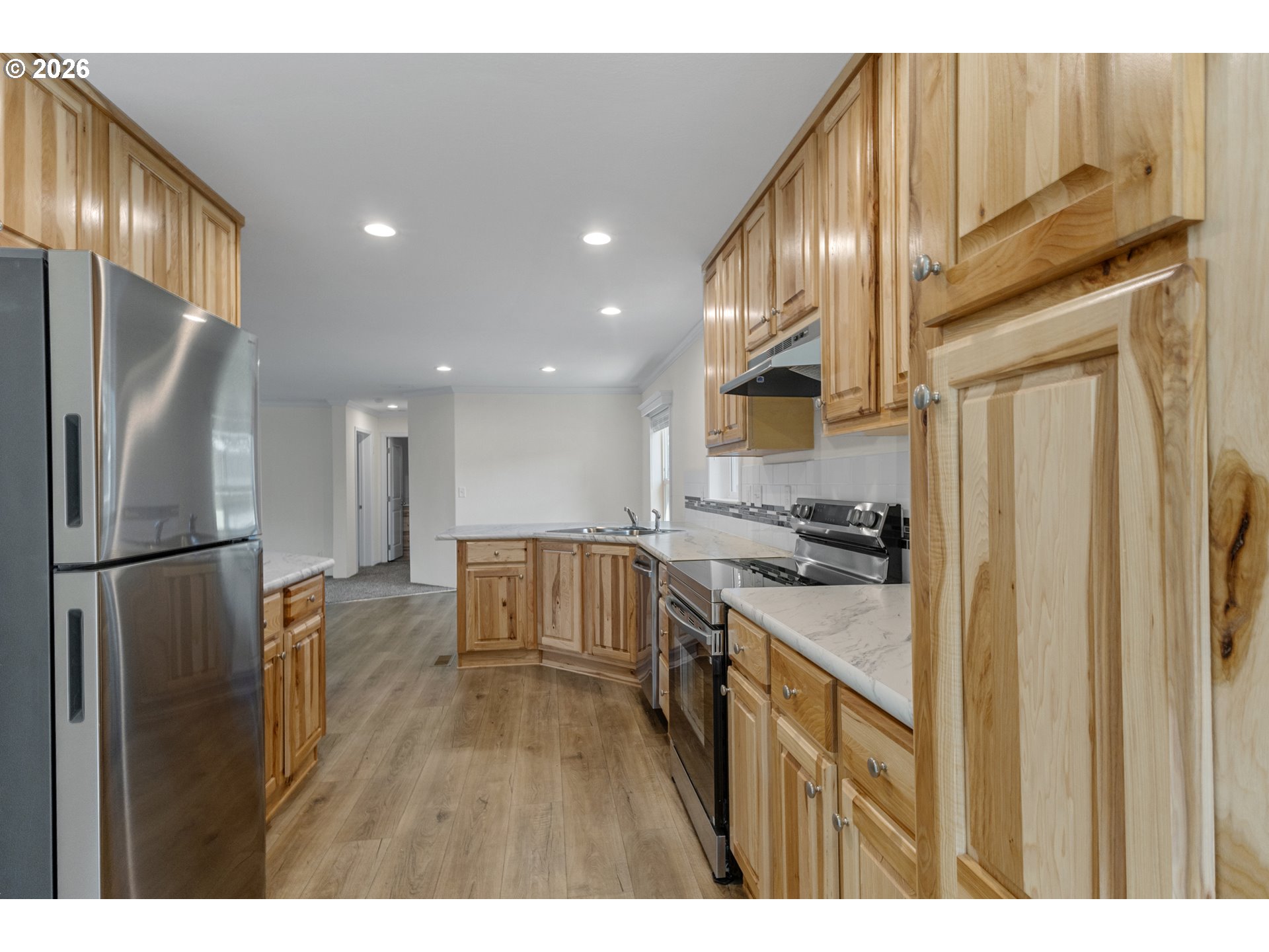365 Mountain View Road Sweet Home, OR 97386 - Photo 13 of 32 a kitchen with stainless steel appliances granite countertop a refrigerator a stove and a sink