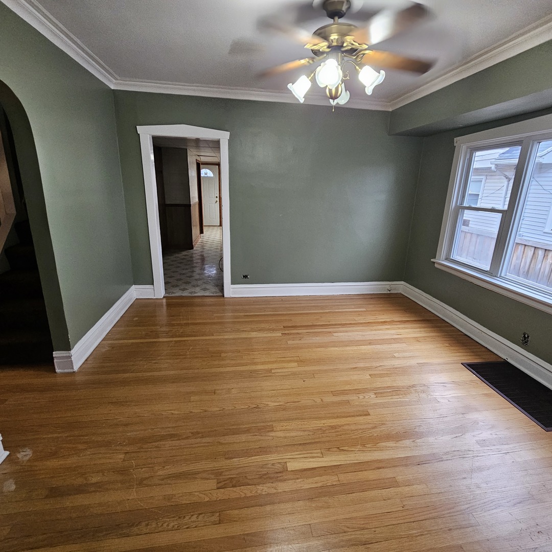 2125 South 3rd Avenue Maywood, IL 60153 - Photo 29 of 29 a view of an empty room with window and wooden floor