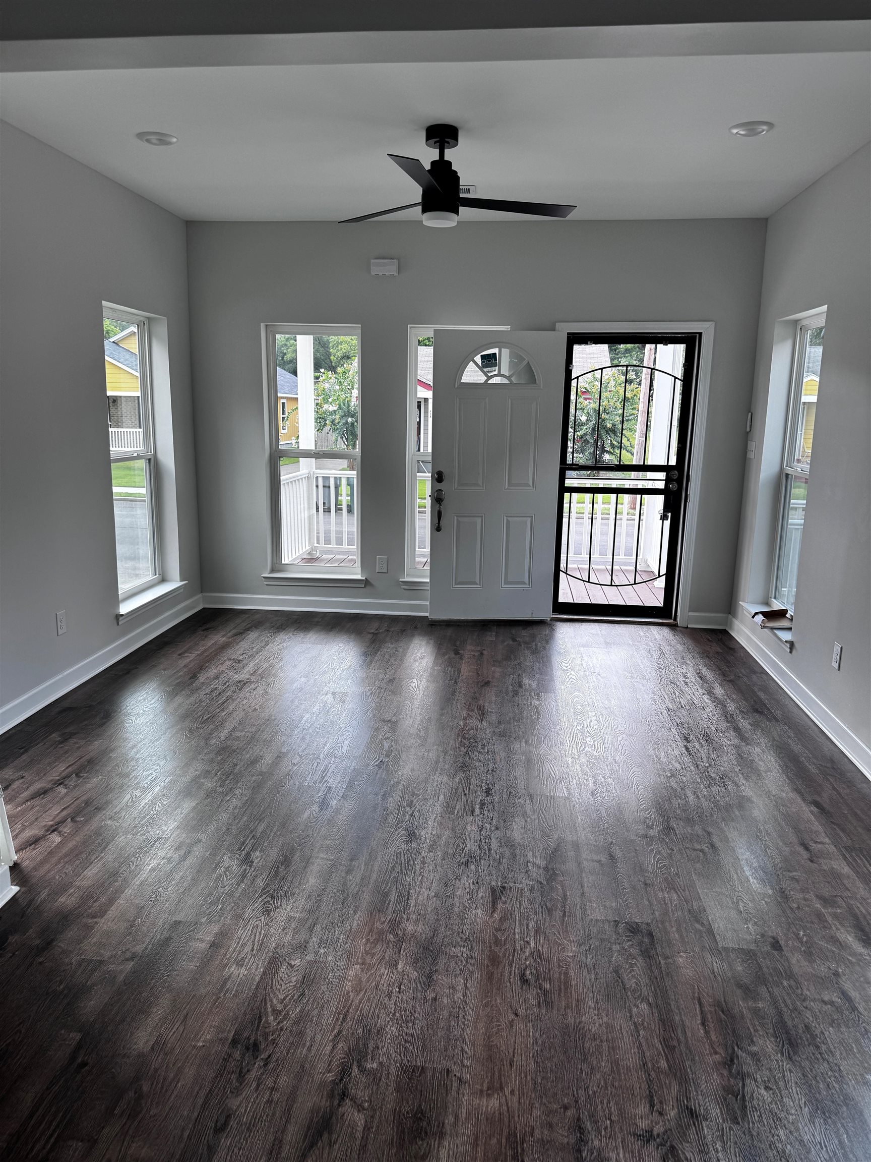 818 Semmes Street Memphis, TN 38111 - Photo 2 of 7 a view of an empty room with wooden floor and a window