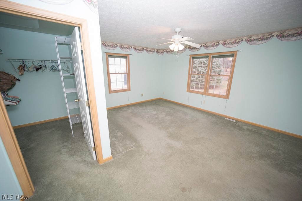 48120 Cooper Foster Park Road Amherst, OH 44001 - Photo 11 of 29 Owners suite has a generous walk in closet and ensuite (not pictured)