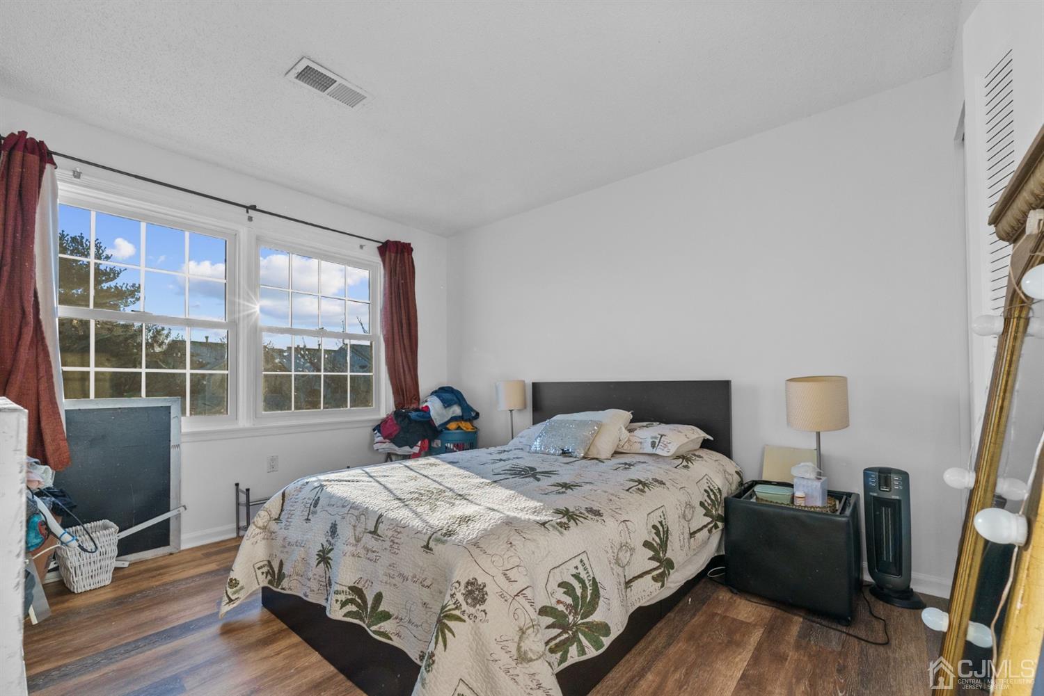 134 Edpas Road New Brunswick, NJ 08901 - Photo 14 of 16 a bedroom with a bed and a window