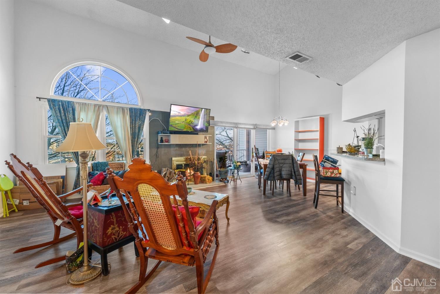 134 Edpas Road New Brunswick, NJ 08901 - Photo 3 of 16 a view of a dining room with furniture and a flat screen tv