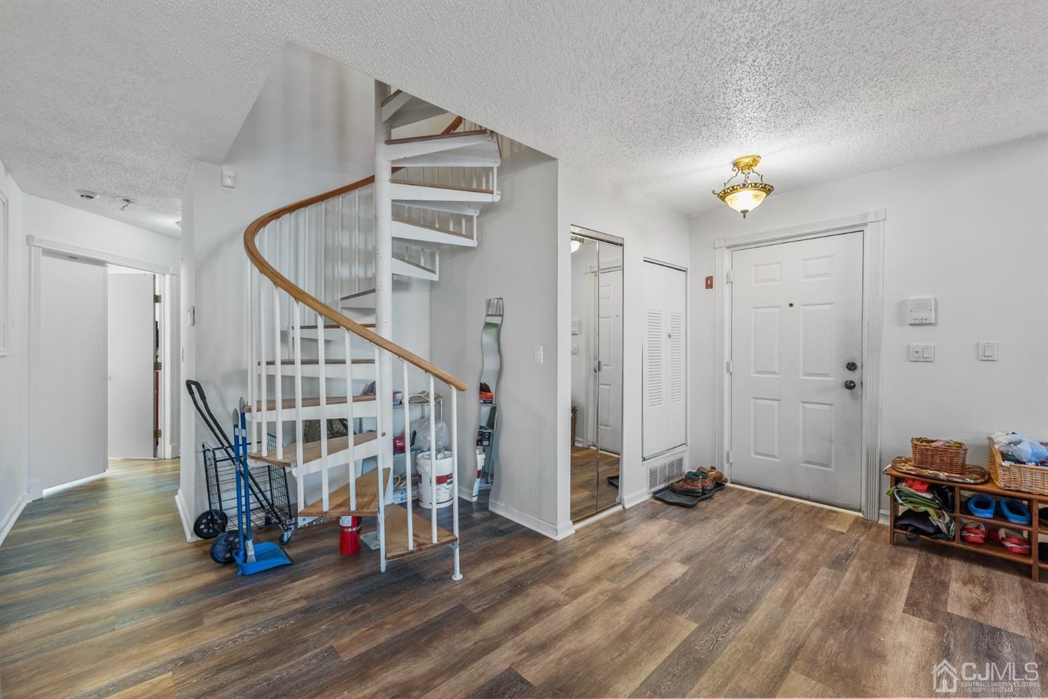 134 Edpas Road New Brunswick, NJ 08901 - Photo 8 of 16 a view of entryway with wooden floor and stairs