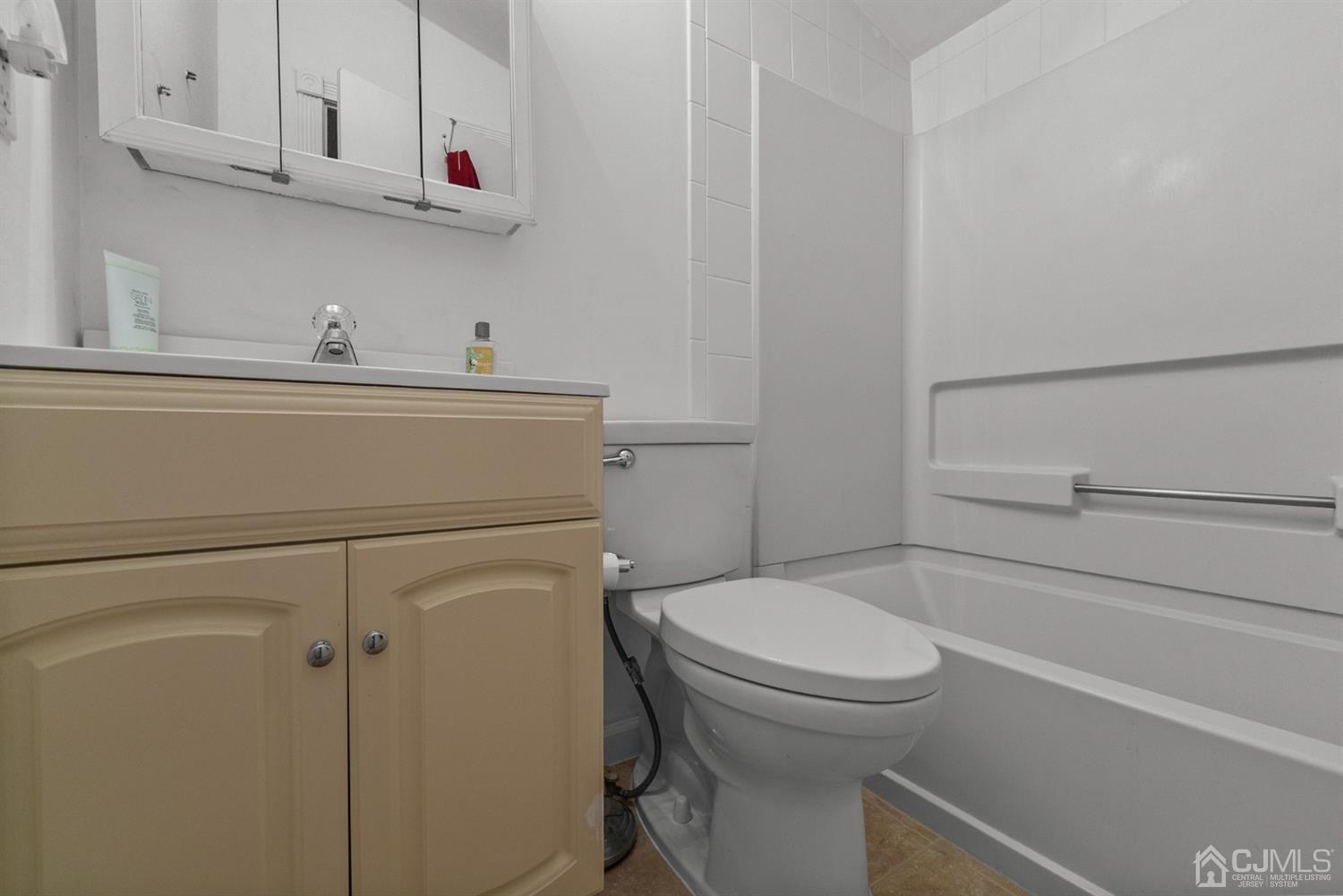 134 Edpas Road New Brunswick, NJ 08901 - Photo 10 of 16 a bathroom with a toilet and a sink