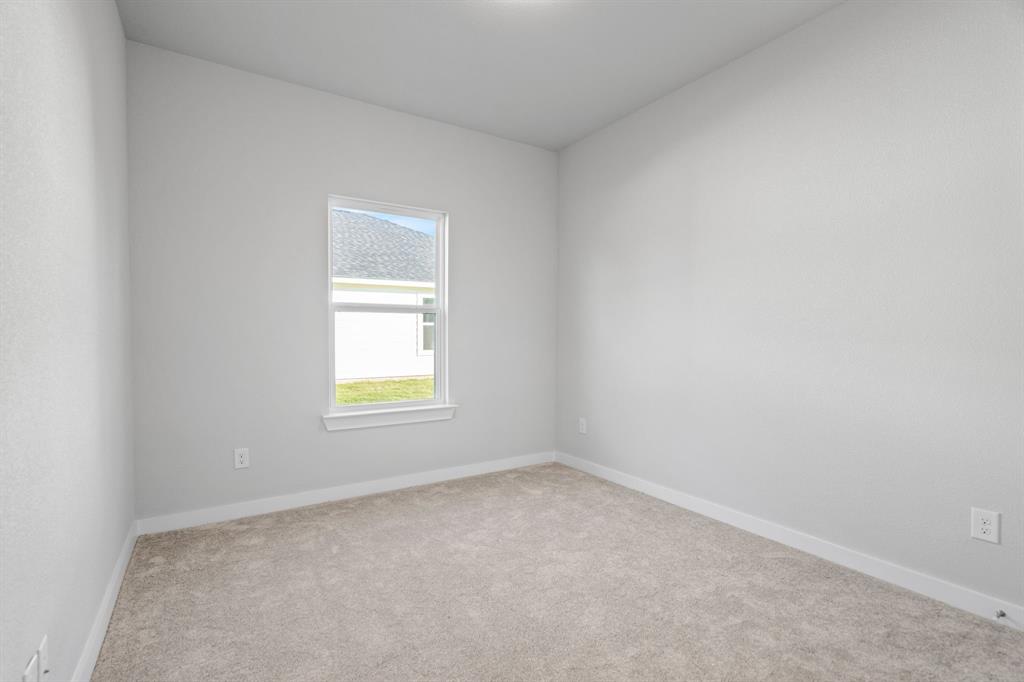 227 Faith Lane Tioga, TX 76271 - Photo 22 of 26 an empty room with a window