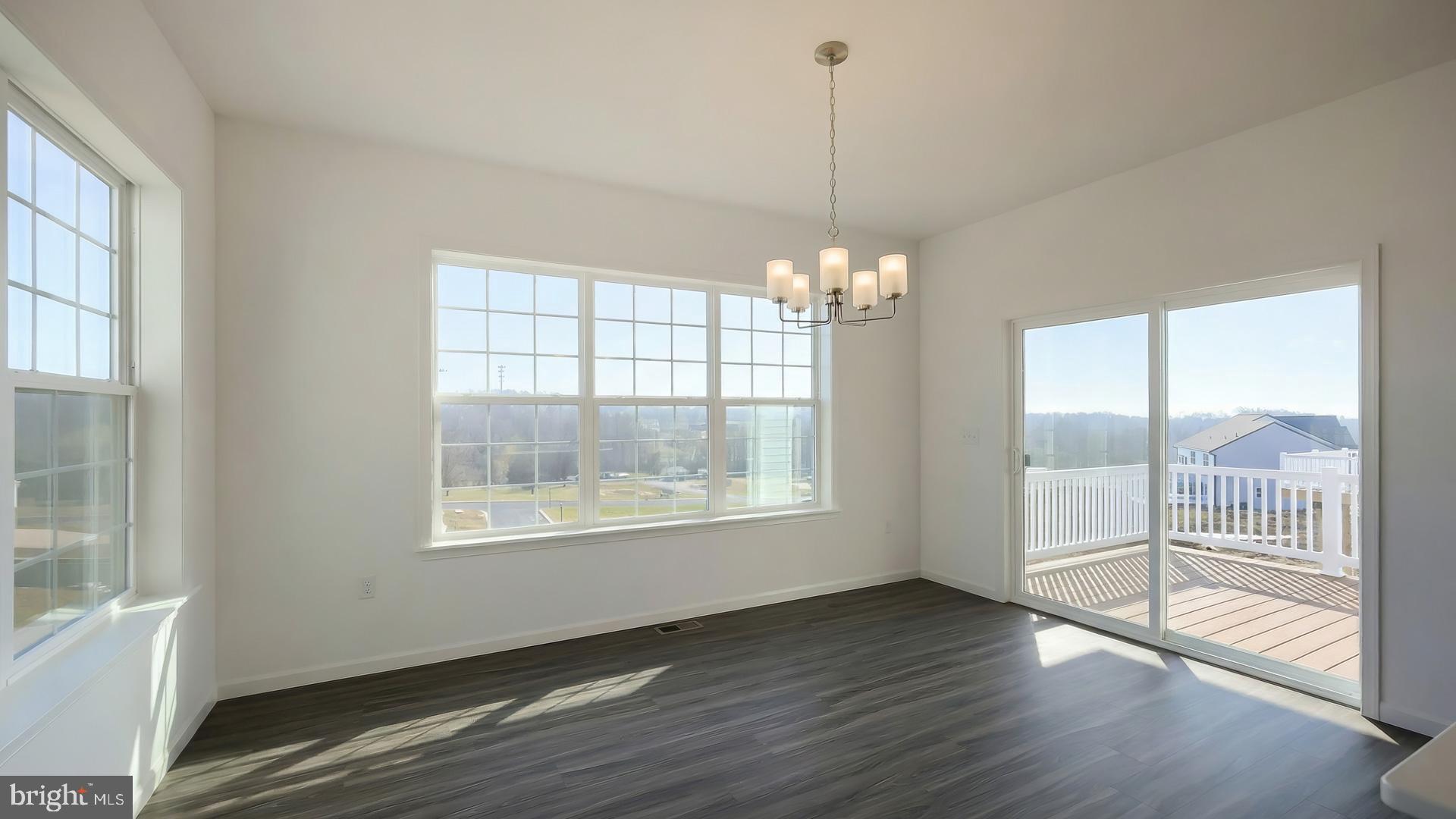 217 Copper Ridge Drive Newmanstown, PA 17073 - Photo 13 of 30 a view of an empty room with wooden floor and a window