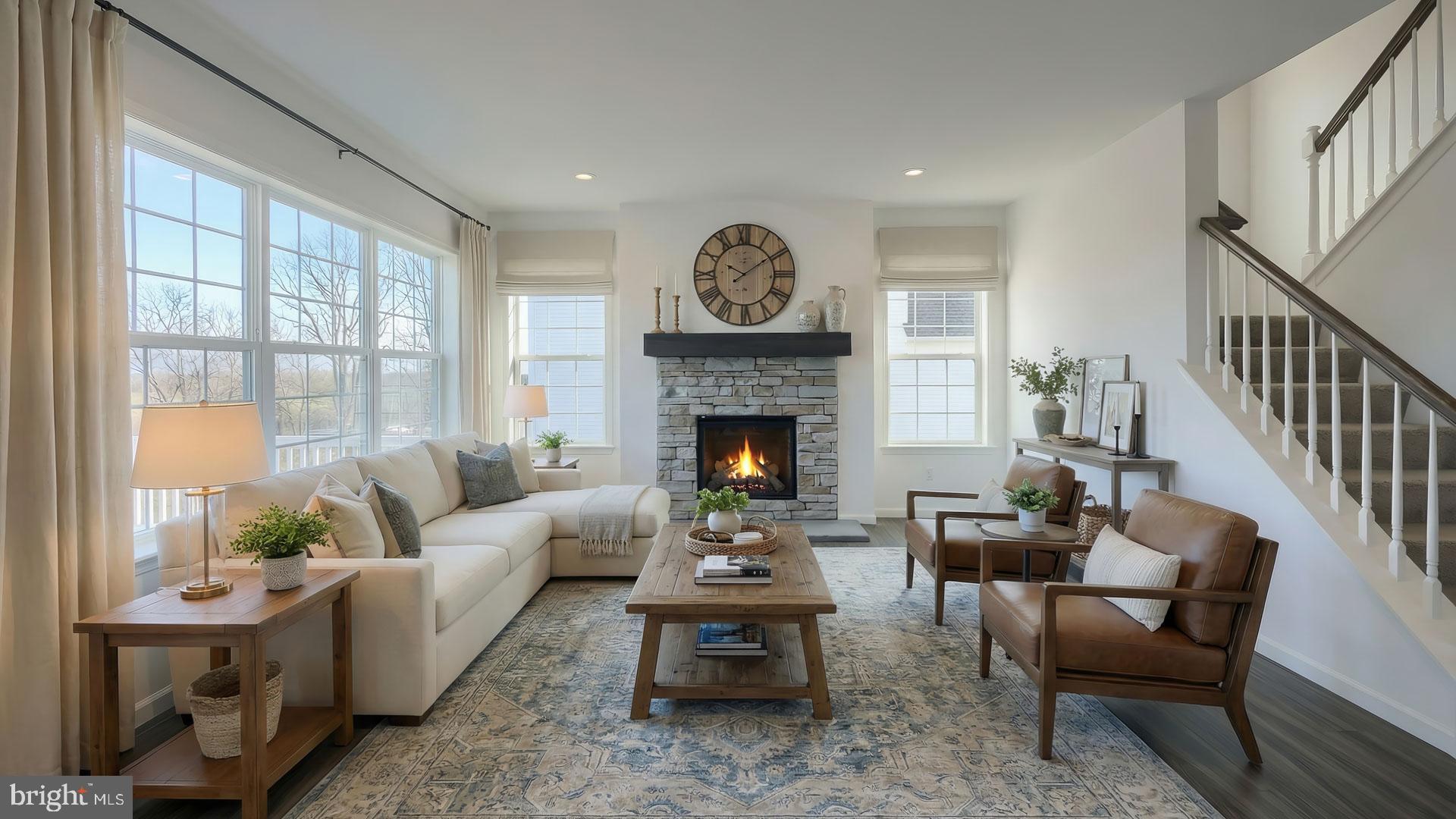 217 Copper Ridge Drive Newmanstown, PA 17073 - Photo 2 of 30 a living room with furniture a fireplace and a large window