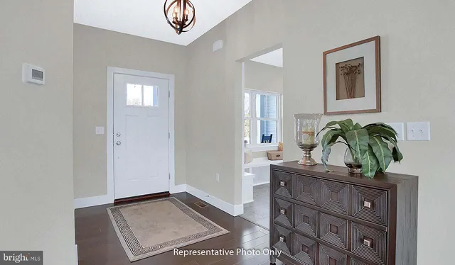 a view of entryway with wooden floor