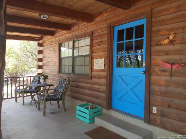 a view of a porch with furniture and a window