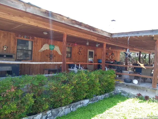 a view of a chair and tables in the patio