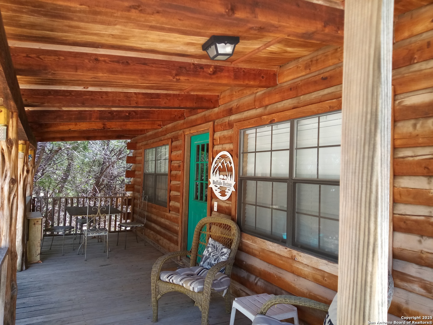 902 Mariposa Concan, TX 78838 - Photo 4 of 10 a room with wooden floor table and chairs