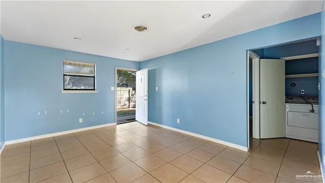 a view of an empty room with a window