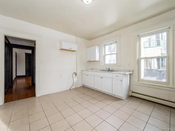 a view of a kitchen with a sink cabinets and a window