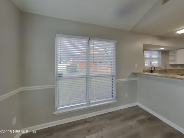 a view of storage and utility room with window