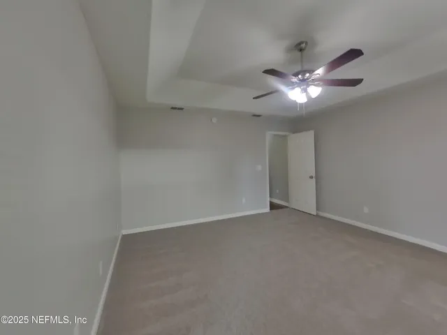 an empty room with a view of a bathroom