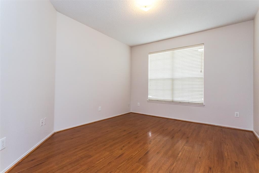 738 Opal Lane Mesquite, TX 75149 - Photo 17 of 31 Spare room with wood finished floors and a textured ceiling