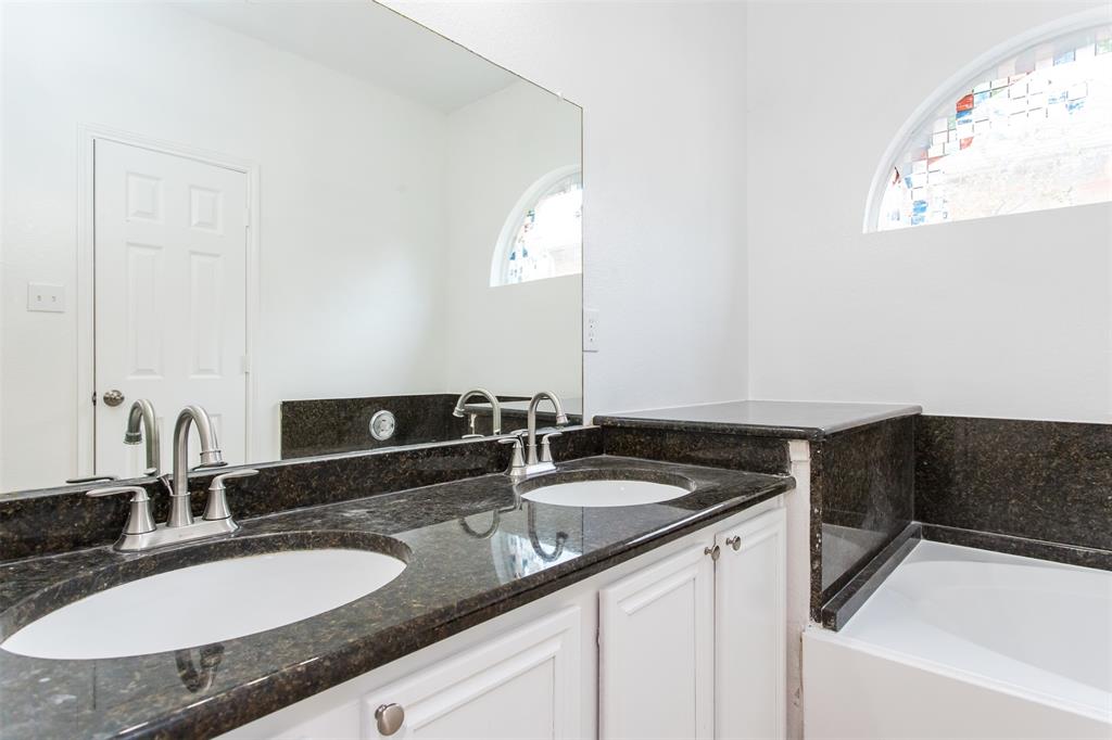 738 Opal Lane Mesquite, TX 75149 - Photo 18 of 31 Bathroom featuring a garden tub and double vanity
