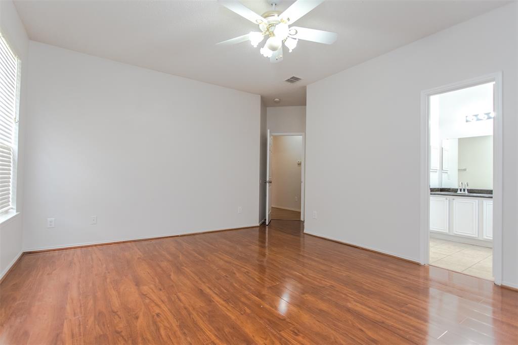 738 Opal Lane Mesquite, TX 75149 - Photo 19 of 31 Empty room featuring light wood finished floors and ceiling fan