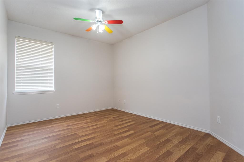 738 Opal Lane Mesquite, TX 75149 - Photo 26 of 31 Spare room with wood finished floors and a ceiling fan