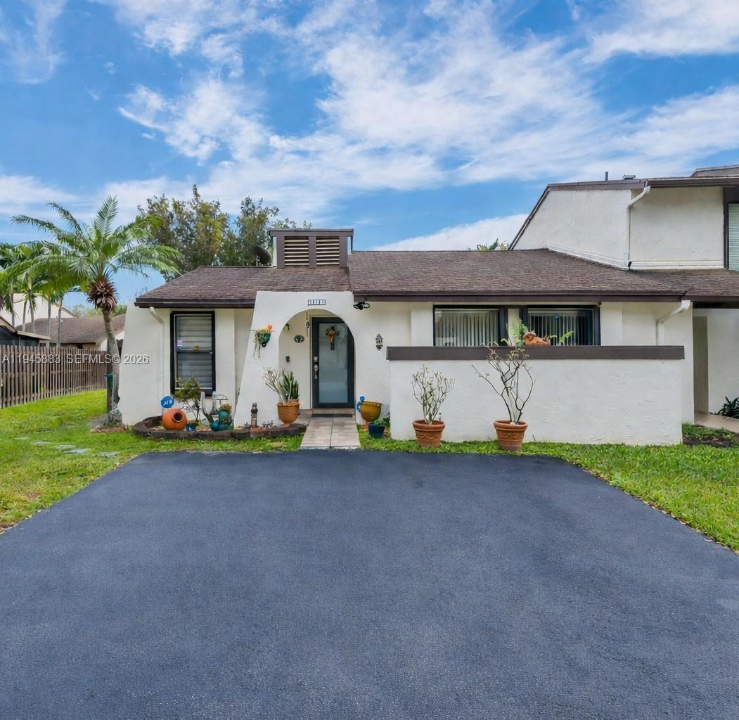 12736 Southwest 68th Lane Miami, FL 33183 - Photo 1 of 37 a front view of a house with porch
