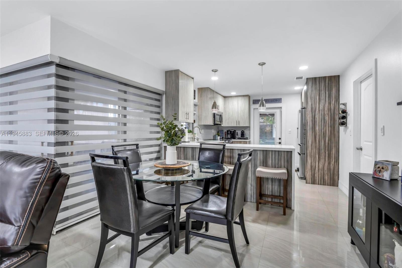 12736 Southwest 68th Lane Miami, FL 33183 - Photo 12 of 37 a dining room with furniture and window