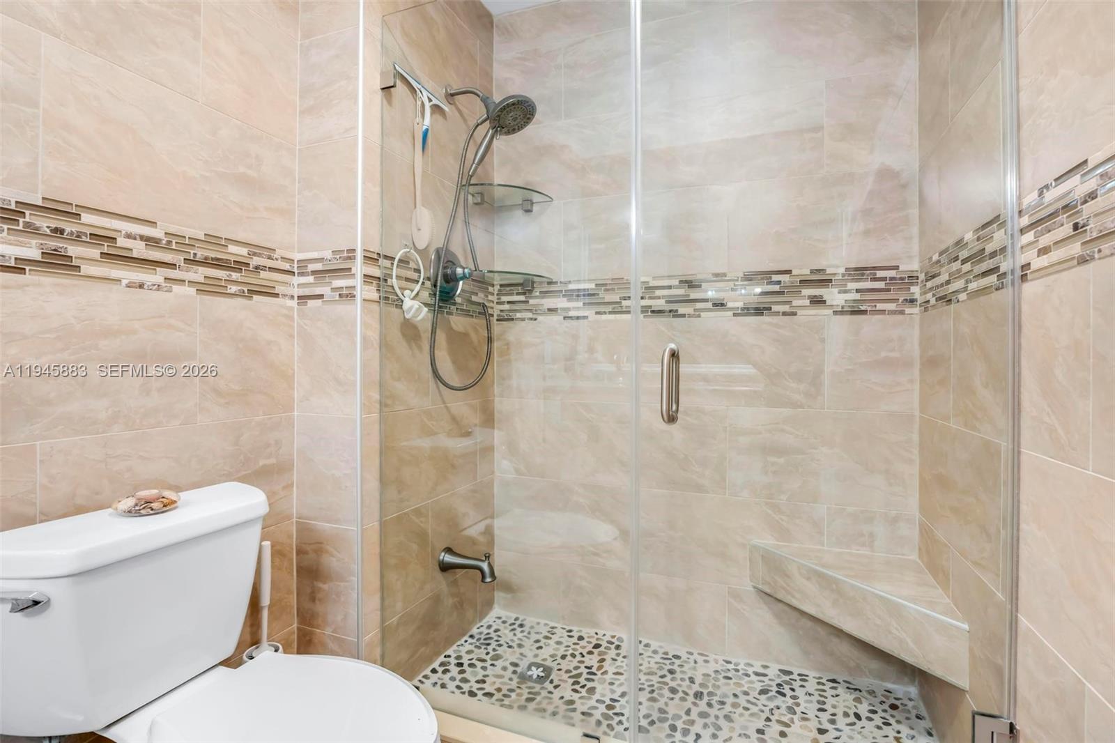 12736 Southwest 68th Lane Miami, FL 33183 - Photo 22 of 37 a white toilet sitting next to a bath tub and shower