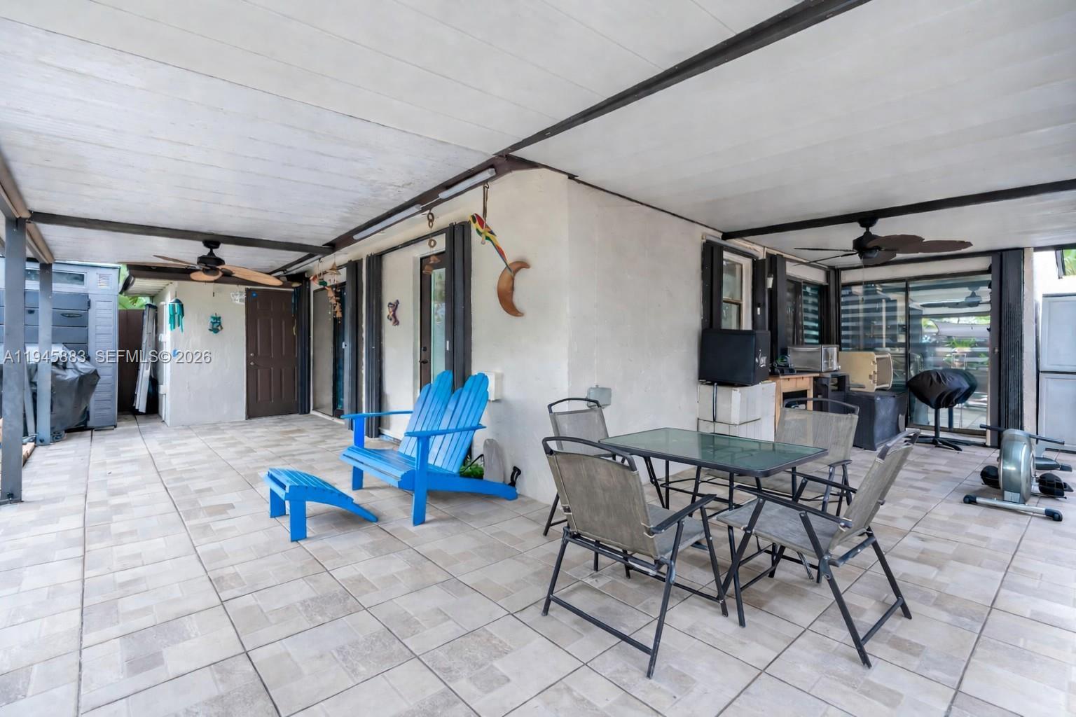 12736 Southwest 68th Lane Miami, FL 33183 - Photo 26 of 37 a view of a livingroom with furniture and window