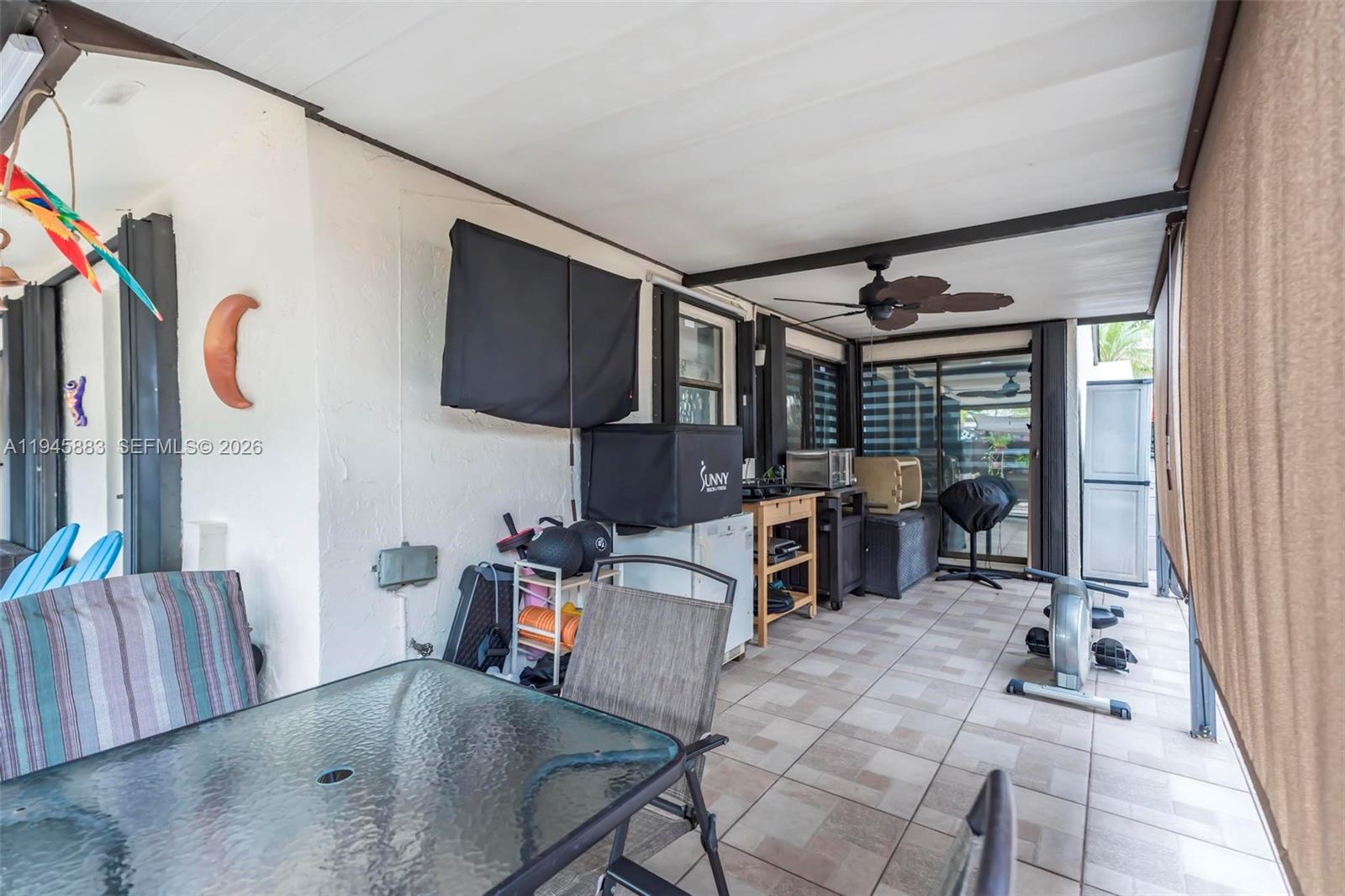 12736 Southwest 68th Lane Miami, FL 33183 - Photo 29 of 37 a view of a living room and dining room