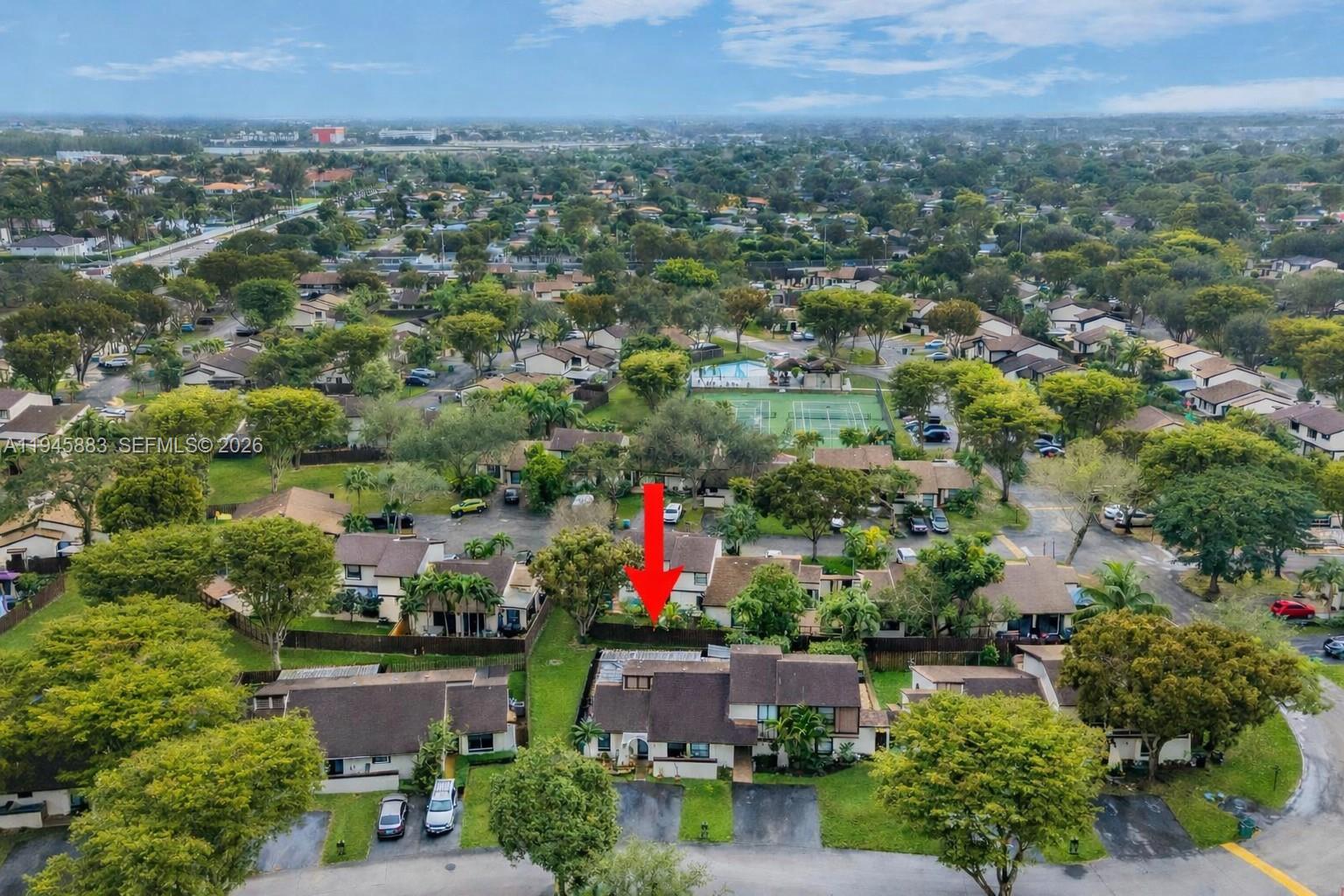 12736 Southwest 68th Lane Miami, FL 33183 - Photo 32 of 37 an aerial view of residential house with green space and lake view