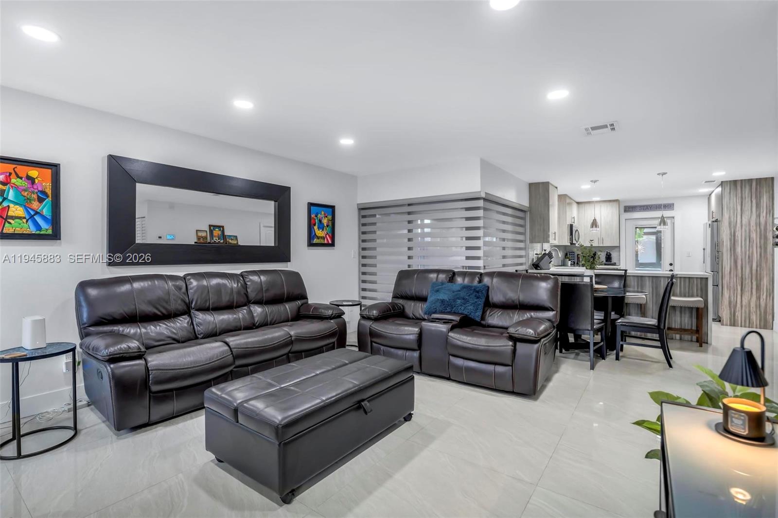 12736 Southwest 68th Lane Miami, FL 33183 - Photo 8 of 37 a living room with furniture and a flat screen tv