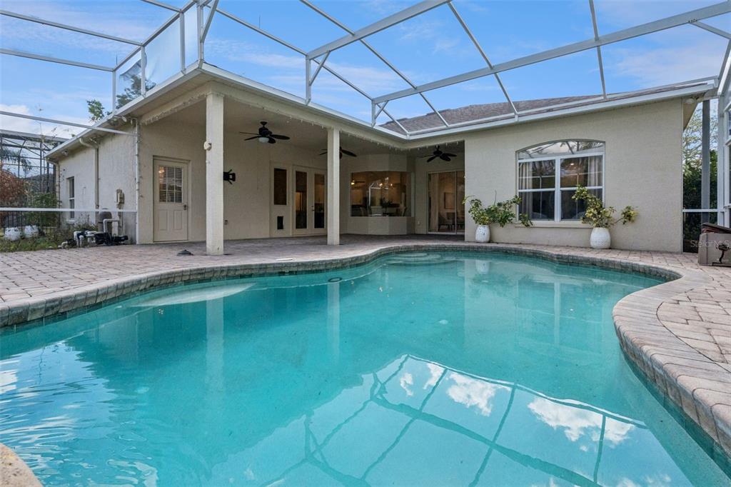 2541 Teton Stone Run Orlando, FL 32828 - Photo 13 of 82 a view of a house with a swimming pool