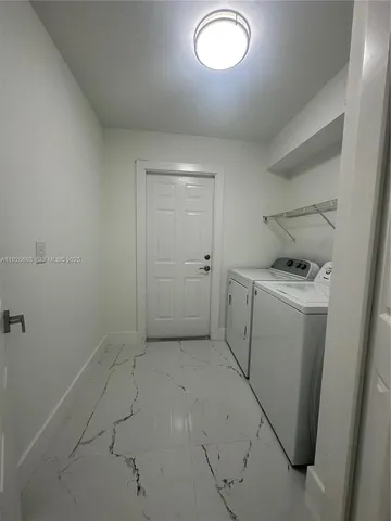 a storage & utility room with a sink