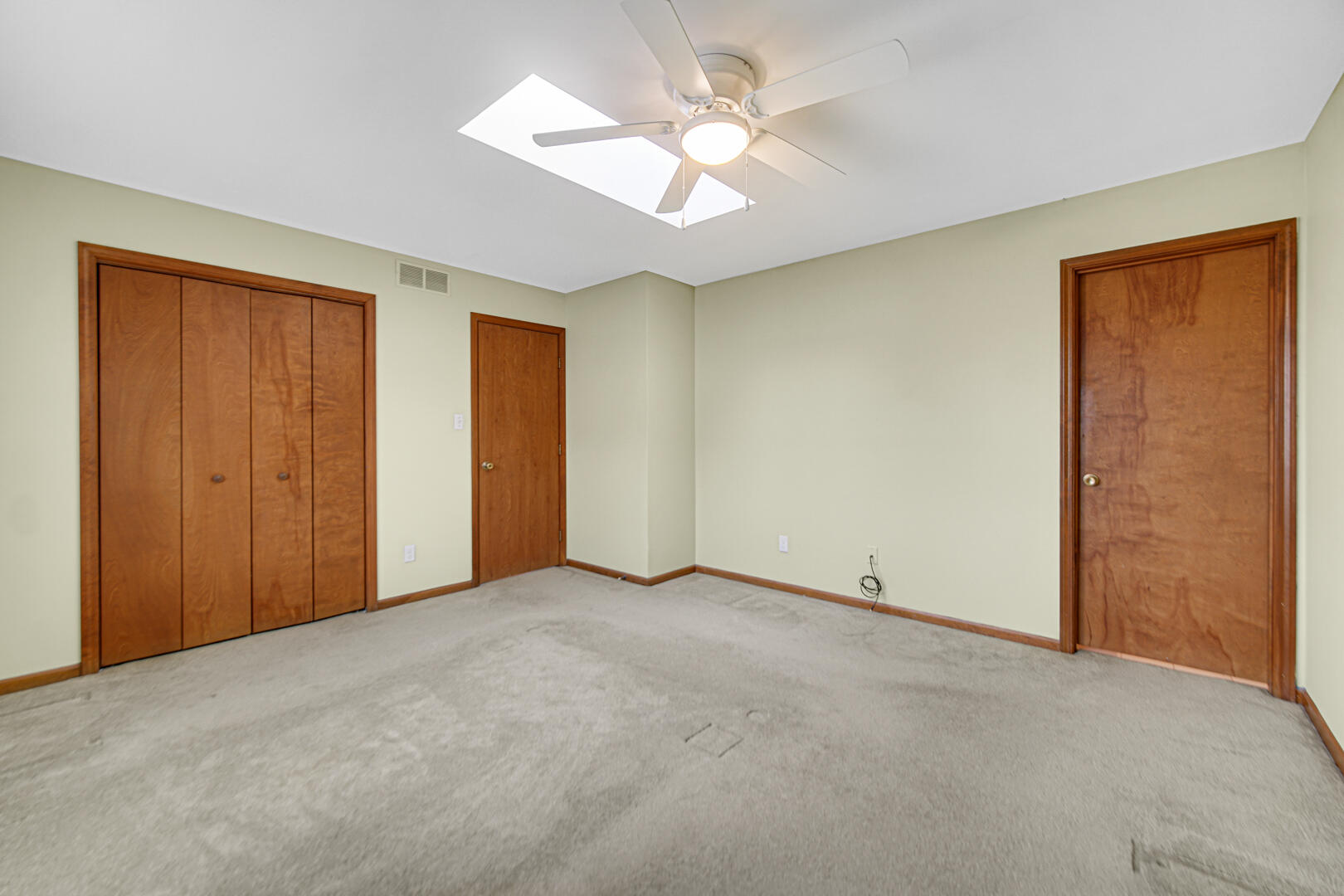 700 Meadow Lane Crown Point, IN 46307 - Photo 17 of 28 an empty room with a ceiling fan and a window