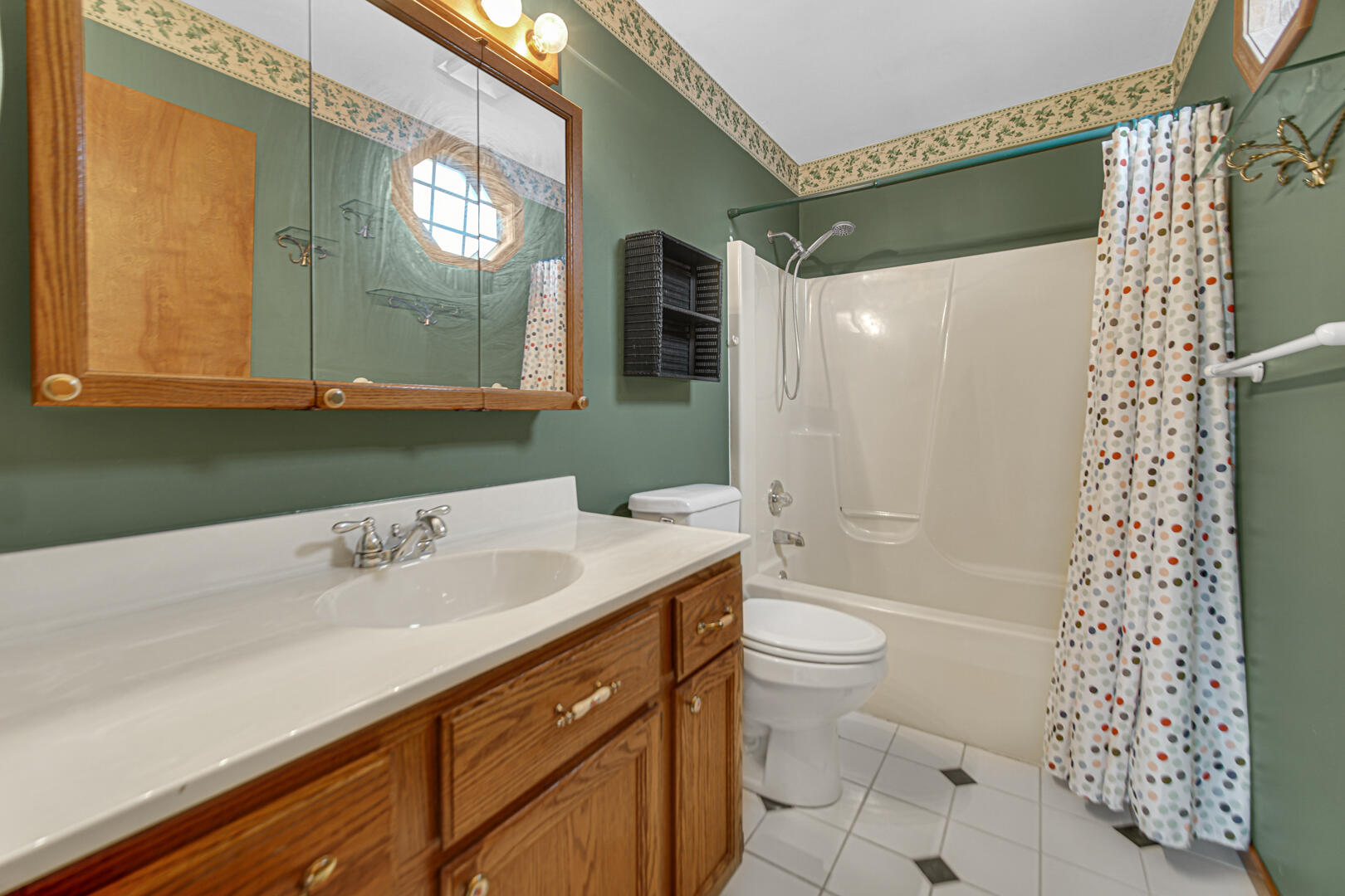 700 Meadow Lane Crown Point, IN 46307 - Photo 18 of 28 a bathroom with a sink a toilet a mirror and shower