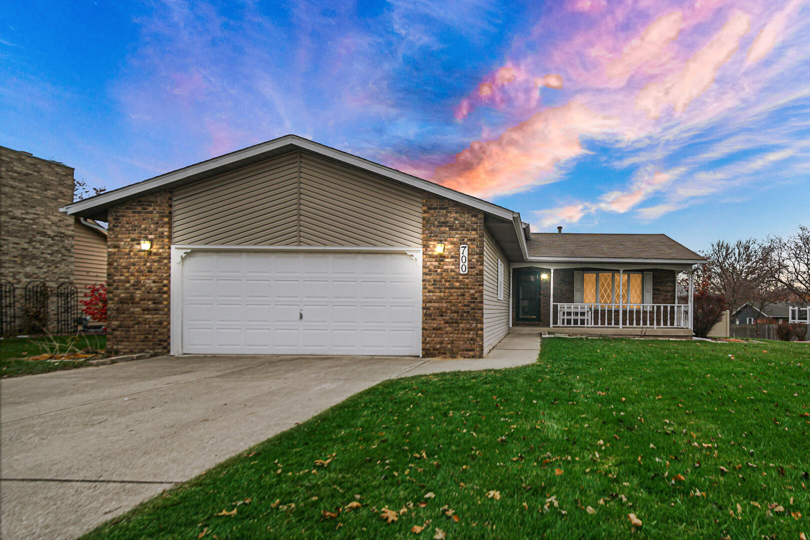 700 Meadow Lane Crown Point, IN 46307 - Photo 2 of 28 a front view of a house with a yard and garage